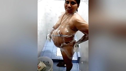 Busty brunette shows her natural tits in solo video