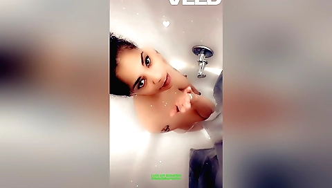 Indian naked brunette in the bathroom in the shower