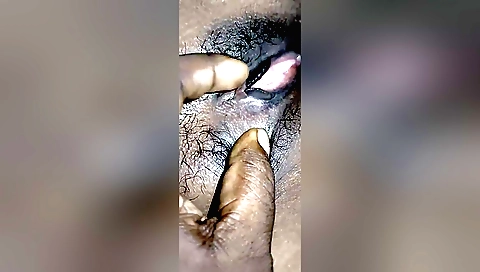 A hairy teen enjoys taking care of herself in the amateur video