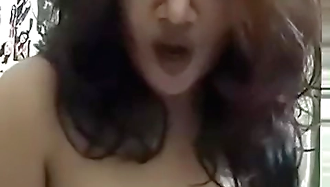 Sexy brunette shows off her boobs and body on webcam video