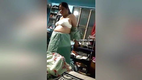 Busty bhabhi shows off her big ass and tits on web camera