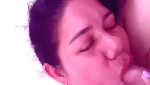 Brunette milf with big tits sucking a cock and giving blowjob