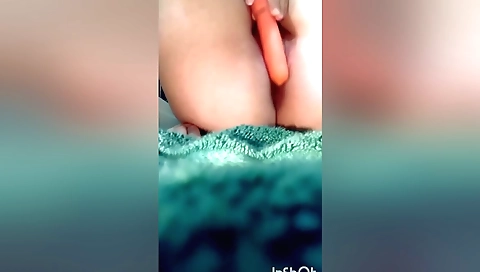 Cute girl sucking carrot toy and sticking one up her pussy
