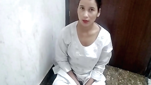 Solo female moves her legs and fingers on the desk