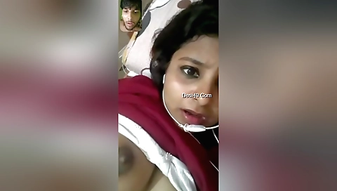 Indian brunette girl in a white dress shows off ass and boobs
