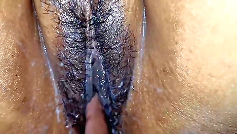 Indian hairy whore is on her back and getting fucked