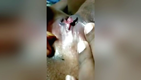 A desi wife is on the couch and doing a solo masturbation