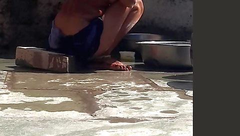 Indian stepsister-in-law in the bath on the edge of the forest