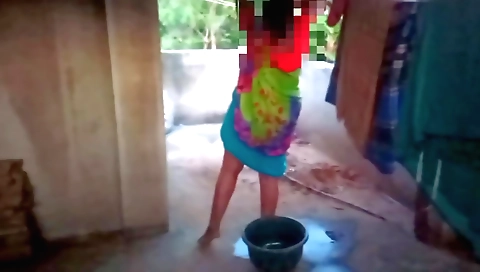 Indian housewife takes off her clothes in the kitchen