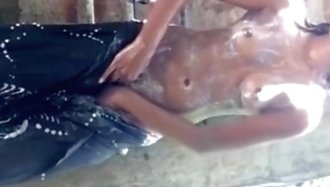 Indian amateur brunette in outdoor bath and a sexy bikini