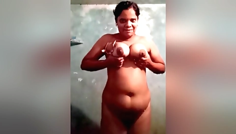 Busty indian milf in a white blouse and red skirt in the shower