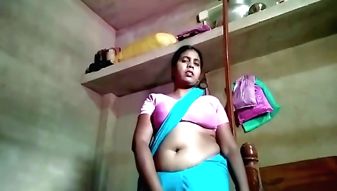 Indian wife in sexy bikini wearing sexy dress on a sofa