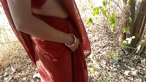 Indian chick in outdoor clothes riding on a bicycle